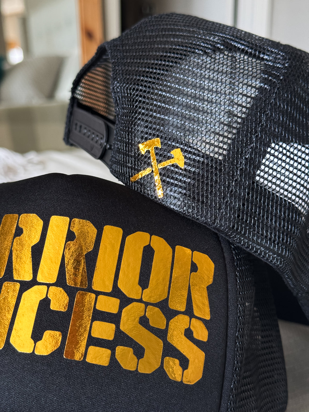 WARRIOR PRINCESS V1 GOLD FOIL TRUCKER HAT IN BLACK