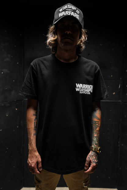 FLAGSHIP WORSHIP IS WARFARE PREMIUM STANDARD ISSUE TEE IN BLACK