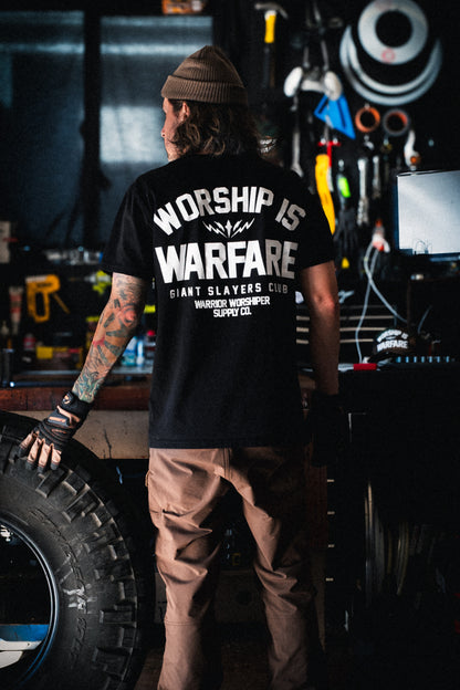 FLAGSHIP WORSHIP IS WARFARE PREMIUM STANDARD ISSUE TEE IN BLACK