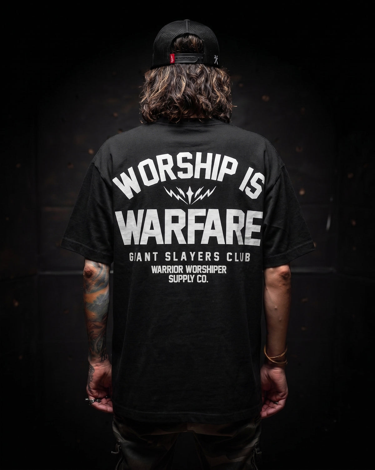 [NEW] FLAGSHIP WORSHIP IS WARFARE PREMIUM OVERSIZED TEE IN RUSTIC BLACK 7.5 oz