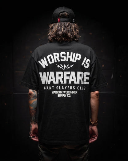 [NEW] FLAGSHIP WORSHIP IS WARFARE PREMIUM OVERSIZED TEE IN RUSTIC BLACK 7.5 oz